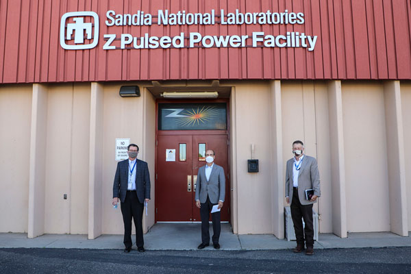 Mark Menezes, James Peery and Jeff Harrell in front of Z Pulsed Power building