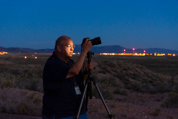 Sandia photojournalist Randy Montoya works with his camera