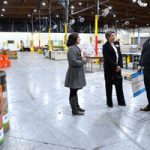 Kayla Norris and Dori Ellis tour food bank with Juan Francisco Orozco