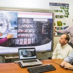 Sandia computer scientists and Goodyear engineers study images of tire technology