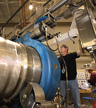 Tom Raber (8137) prepares the EXPLOSIVES DESTRUCTION SYSTEM (EDS) explosive containment vessel for shipment to the US Army Pueblo Chemical Depot. Over the next five years, two EDS units are expected to process more than 1,000 chemical munitions as part of a larger cleanup operation at the Pueblo, Colorado, facility.  (Photo by Dino Vournas)