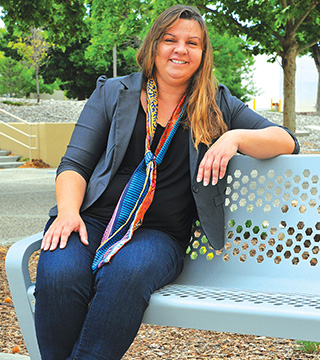 Image of <p>GIVING BACK — Computer scientist Sandra Faust, a mother of two, reaches out to Albuquerque young people through a weekly math club. “Getting the younger generation involved in STEM, in particular girls, minorities, and the disadvantaged, is very important to me,” she says. “As a professional, I offer another point of view without the grades, tests, and other pressures. I am free to expose children to aspects of math not covered in the classroom, like hands-on activities and games.”     </p>