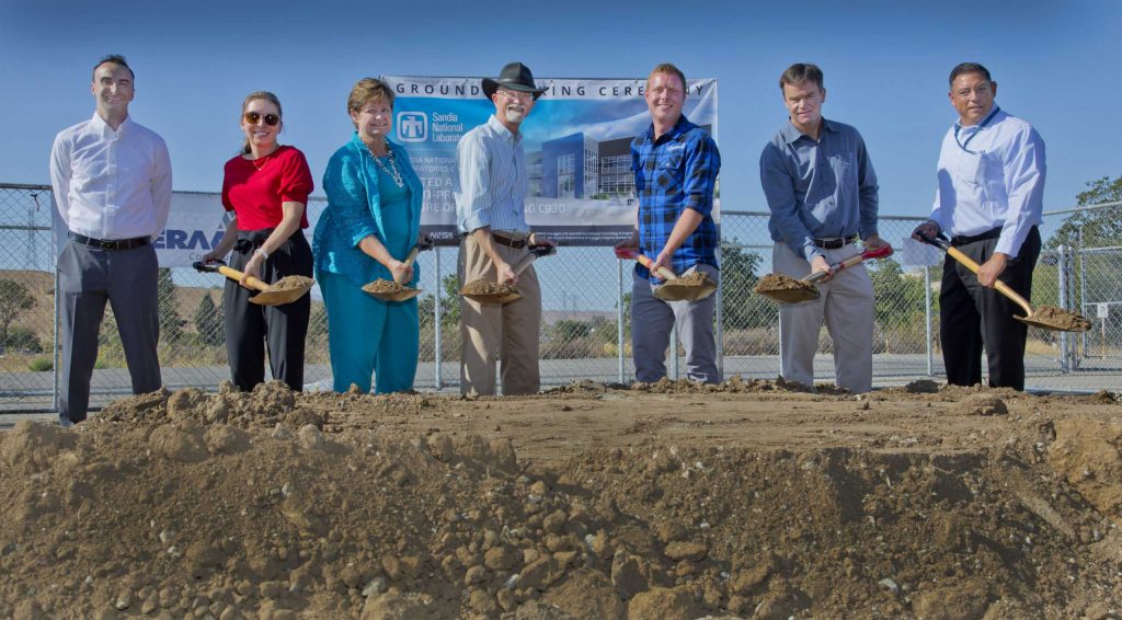 TURNING SHOVELS — From left, Sandia Field Office Officer Thomas McCall, Director Marcey Hoover, Director Pam McKeever, Associate Labs Director Andy McIlroy, Overaa Construction project managers Scott Thompson and Carl Overaa, and Sandia Field Officer Phillip Duarte helped break ground on the new Limited Area Multi-Program building on Aug. 11. (Photo by Dino Vournas)