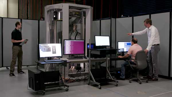 Image of PNNL staffer stands in body scanner