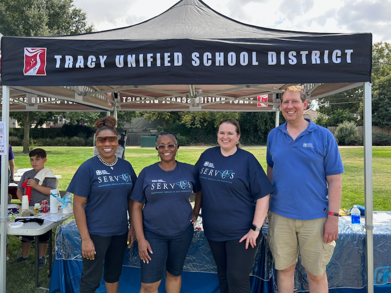 SPREADING STEM — Sandia volunteers, from left, Julia Robinson, Michelle Walker-Wade, Virginia Meagher and Robert Meagher collaborated with Quest Science Center and the Tracy Unified School District to host STEM adventure activities for youth and parents at Tracy Connects on Sept. 9. (Photo by Dean Reece)