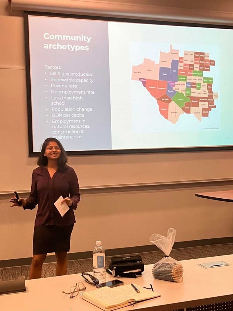 ARCHETYPES — Thushara Gunda, Sandia’s technical lead for the Permian Energy Development Lab, presents work on the types of communities and their characteristics in the Permian Basin region at a community meeting. (Photo courtesy of Alan Cohen, National Science Foundation)