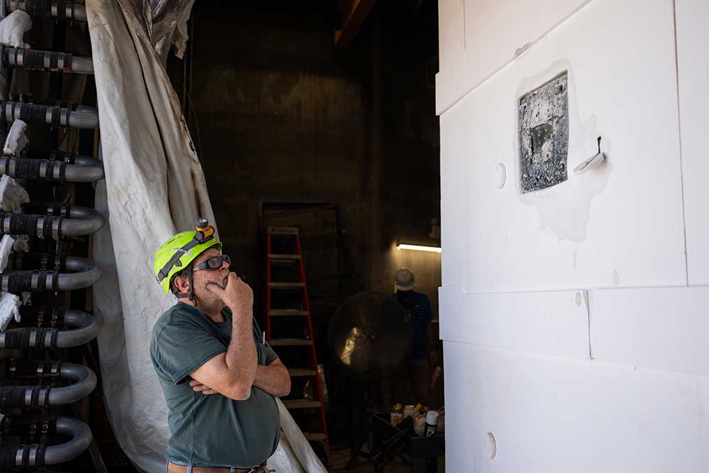 SCORCHING HOT — Sandia mechanical technologist Daniel Ray assesses the results of the Johns Hopkins Applied Physics Laboratory heat shield test in September 2022. (Photo by Craig Fritz)