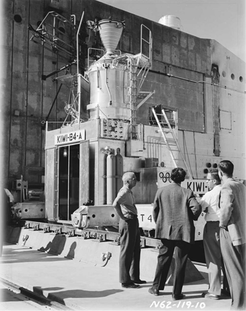 TEST PREPARATIONS — In a photo from 1962, researchers from the Los Alamos Nuclear Rocket Propulsion Division at the Nevada Test Site prepare for a test of the KIWI-B4A, termed a revolutionary, compact and efficient design. (Illustration courtesy of Los Alamos National Laboratory National Security Research Center)