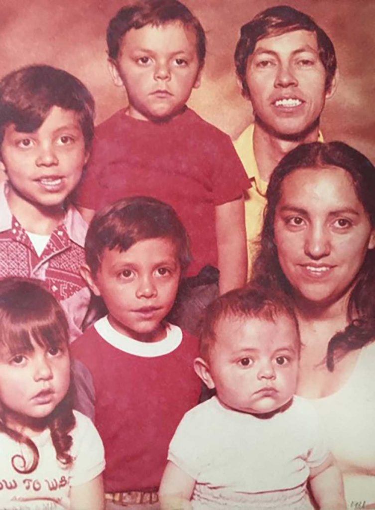 OUTNUMBERED BY THE BOYS — Del, bottom left, in a family photo from 1980 with her parents David and Marcella Tapia, and four brothers David Leon, Carl, Kenneth and Lonnie. (Photo courtesy of Del Salazar)