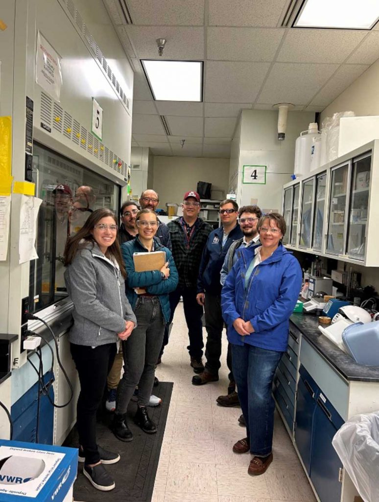 TEAM EFFORT — Smart Labs for National Labs coordinators visited a laboratory in Building 897 in March 2024 to learn more about Sandia’s fume-hood retrofit kits. (Photo courtesy of João Oliveira)