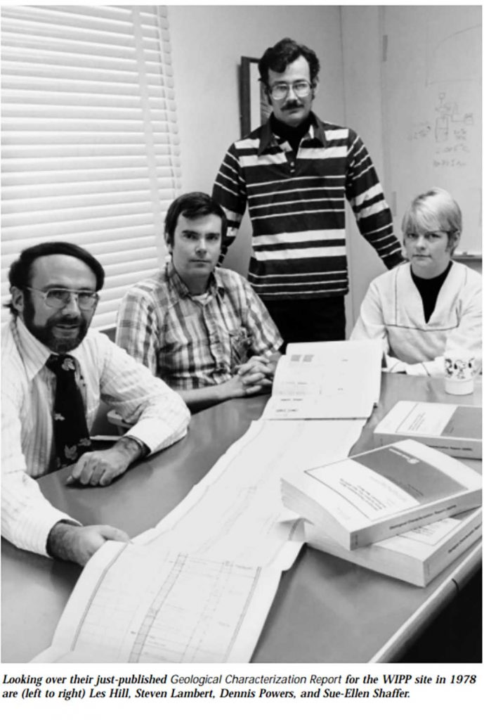 THE GEOLOGY OF WIPP — From left, Les Hill, Steven Lambert, Dennis Powers and Sue-Ellen Shaffer review a just-published geological characterization report on WIPP in 1978. (Photo from a report by Carl J. Mora)