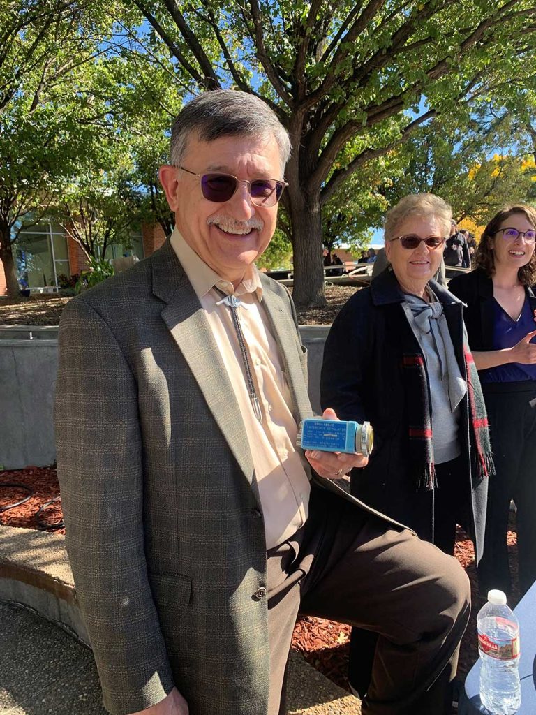 HANDHELD HISTORY — From left, Sandia retiree Andy Rogulich holds the SMU-105/C Interface Simulator with former Labs Corporate Archivist Myra O’Canna and current Archivist Sonia Wilson. (Photo courtesy of Andy Rogulich)